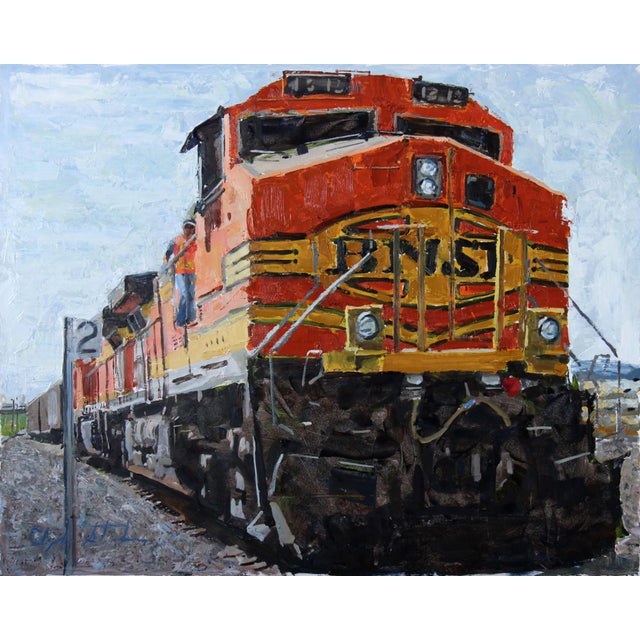 This oil painting depicts a vibrant orange train, captured in a moment of dynamic energy as it prepares to depart. The...