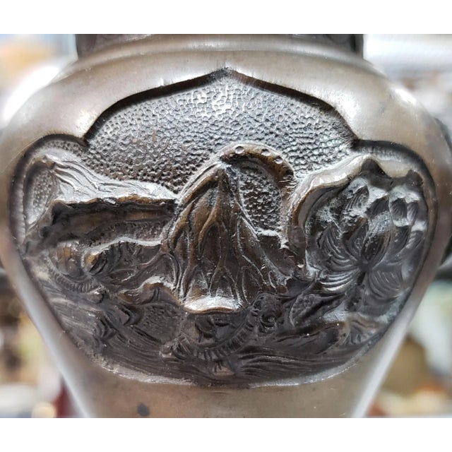 Up for sale is a Late 19th Century Chinese Archaistic Bronze Turtle/Floral Motif Phoenix Head Handles Gu-Form Vase. It...