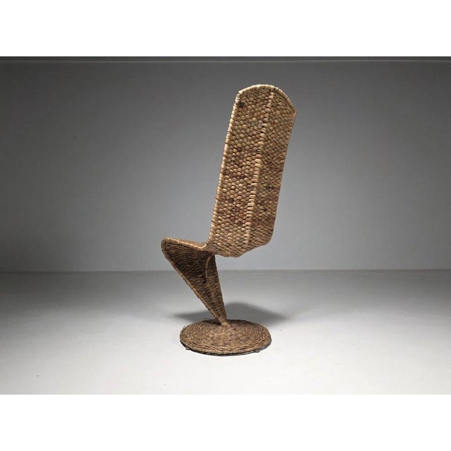 The s chair by italian designer marzio checchi is a sculptural seating object defined by movement, materiality, and form....