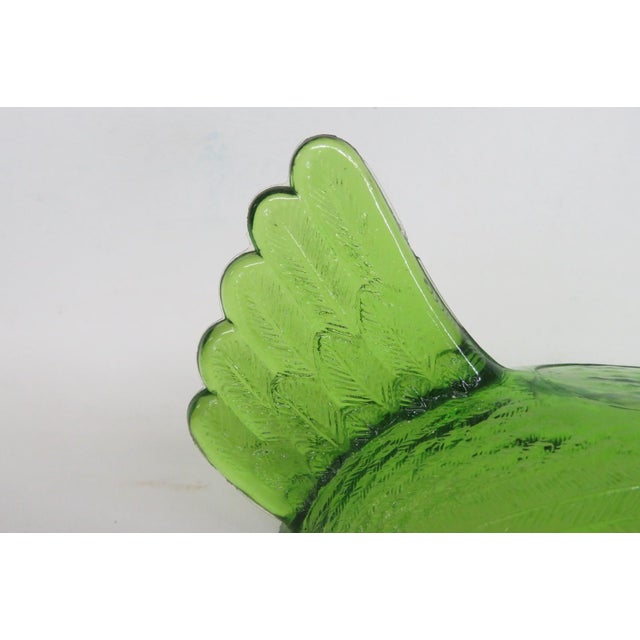 This lovely Chicken Shaped Lid is made of pressed glass. This gorgeous dish cover presents a vibrant green color...