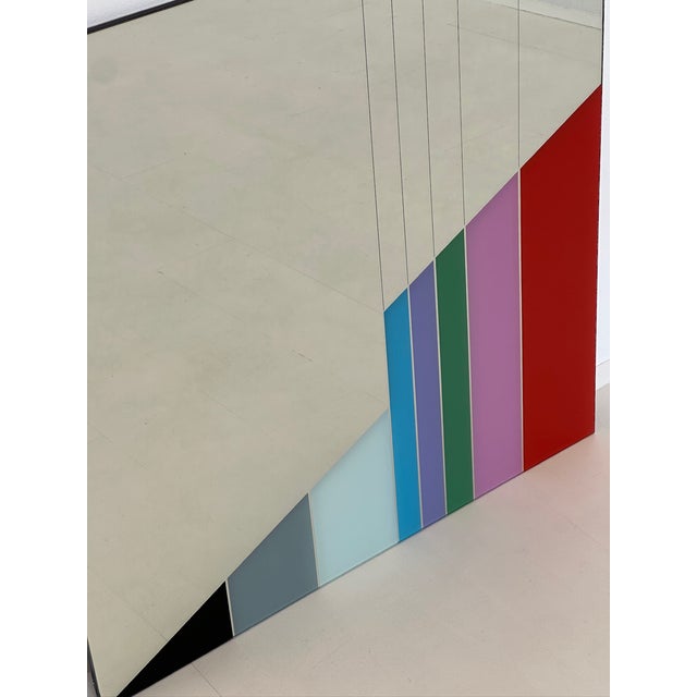 Wall mirror from the “Gli specchi di Carmi” series, designed by Eugenio Carmi for Morphos / Acerbis International in the...