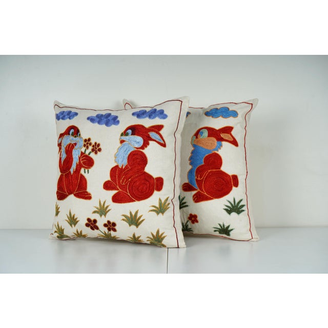 Uzbek Suzani Pillow Cover Elevate your home decor with our Turkish Suzani Pillow Cover, featuring exquisite vintage Uzbek...