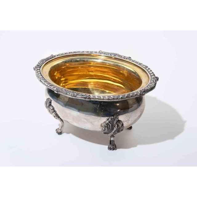 Decorative continental silver open salt or small serving bowl executed in an elegant Rococo Revival style. The oval,...