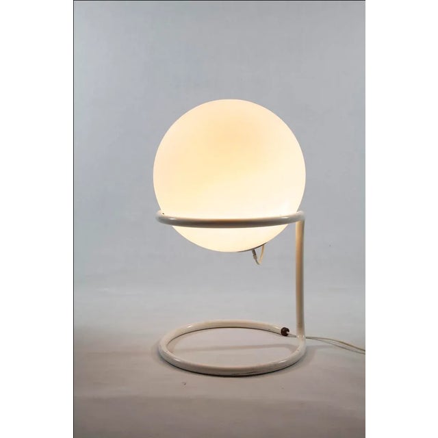 This large glass ball floor lamp was manufactured by Glashütte Limburg. This piece is attributed to the mentioned...