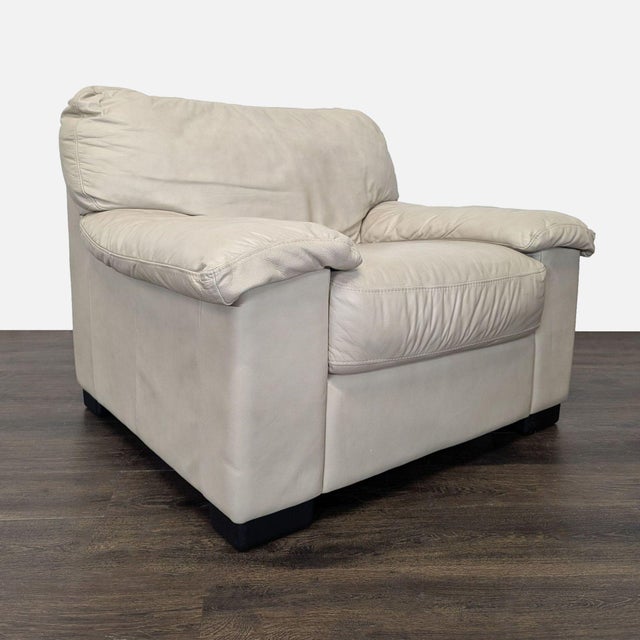 Relax in style with this Italsofa lounge armchair, made from soft beige leather. It features plush cushions and wide...
