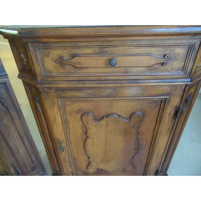 A Fine Pair of Custom Made walnut corner cabinets circa 1950s. Made by a Bespoke cabinet maker in florence Italy. There...