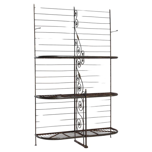 This 1900 French Metal Bakery Rack is a blend of utilitarian function and Parisian charm. Its sturdy iron frame,...