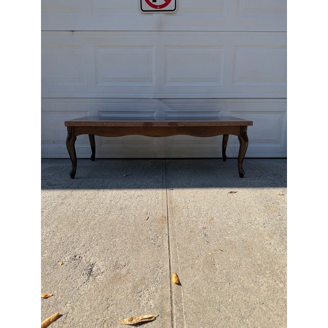 We have an absolutely gorgeous vintage French Provincial coffee table for sale. This vintage cocktail table features a...