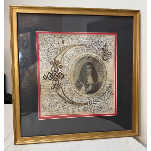 This rare antique hand embellished etching print from the 17th century features a highly detailed hand done calligraphic...