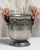 This mid 20th century ice bucket from France is finished in silver. It is fitted with a pair of grape-motif ring handles,...