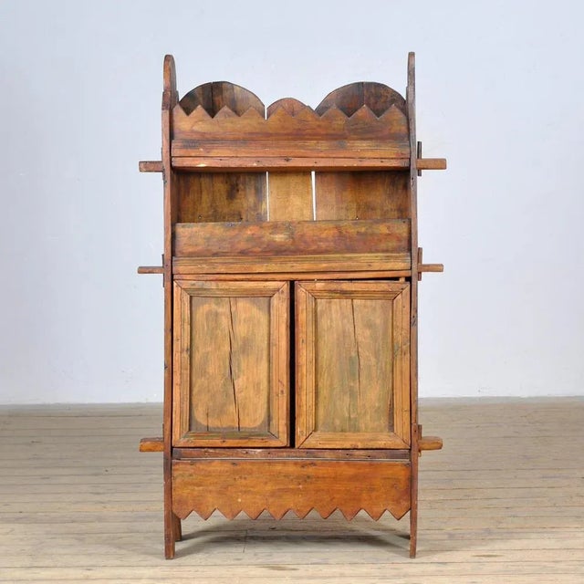 Rustic Wabi Sabi cabinet made of solid beech in Italy, circa 1800. This cabinet offers ample storage space for various...