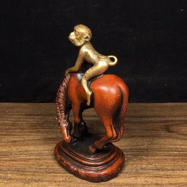 This exquisite piece depicts a finely detailed monkey perched atop a horse, a classic Chinese motif known as "马上封侯" (Ma...