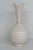 This lovely bud vase is made of porcelain. This gorgeous vase is stamped as being made in the U.S.A by Lenox, see...