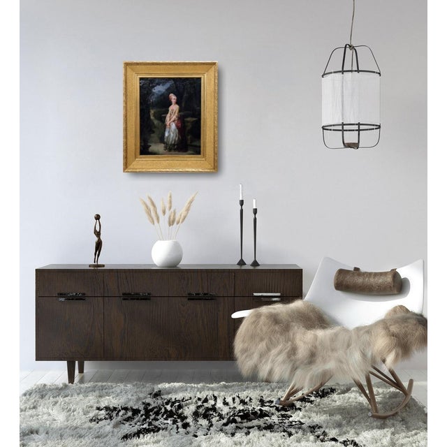 We are pleased to present this oil painting on paper mounted on canvas. Although the painting depicts a young woman with...