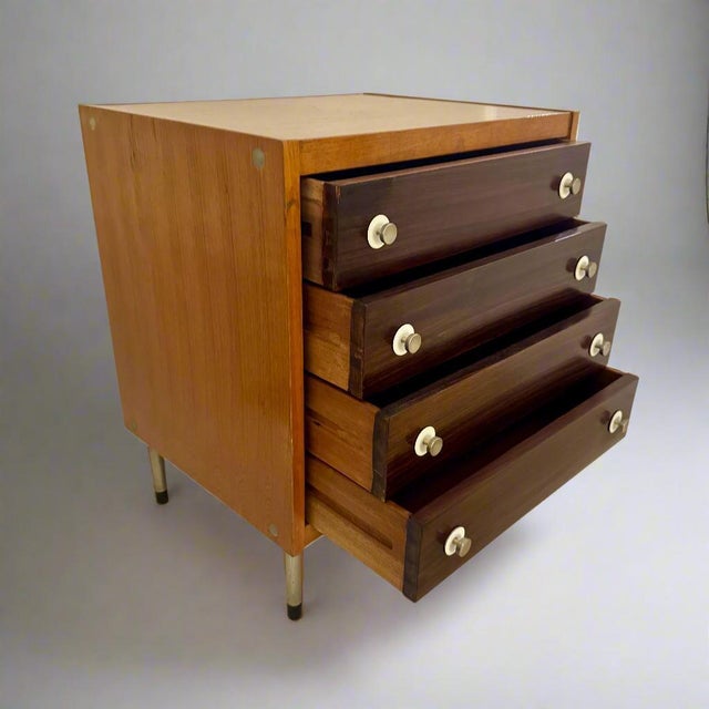 A small Italian Modernist Chest of Drawers. Mahogany with beautiful veneer drawer fronts and original steel pulls and leg...