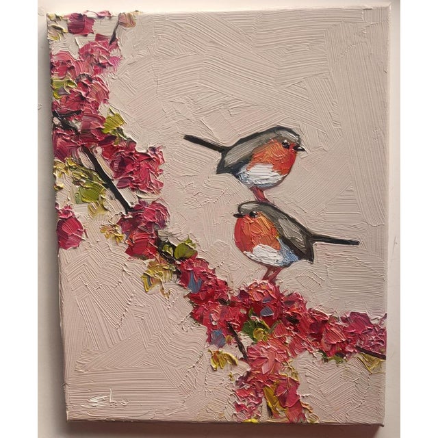 A whimsical oil painting of two robins and pink cherry blossoms, by UK based artist Vivek Mandalia. Frame and hang in your...