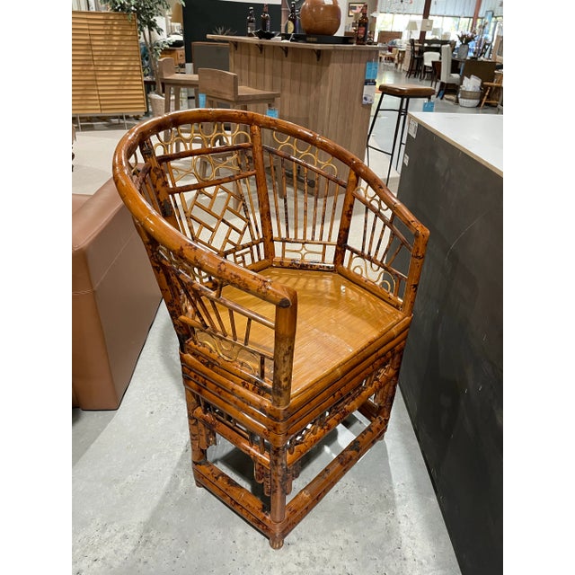 This vintage Brighton Pavilion chair is crafted from rattan and bamboo, showcasing the timeless lattice fretwork and...