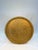 An impressive round brass tray distinguished by intricate engraved botanical ornament and a softly scalloped rim. At more...