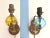 Darling pair of 1950s/60s nautical sconces with solid carved wood back plates accented by gold metal anchors and suspended...