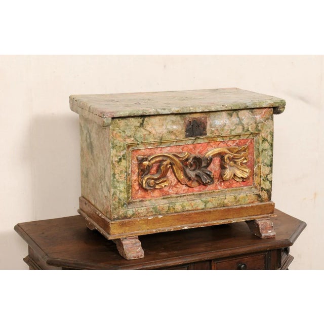 A Venetian Italian box with its original finish, from the 18th century. This antique wood box from Italy is rectangular in...