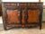 - Buffet with carved doors, a wavy apron, and a warm waxed patina - Fruitwood and elmwood that creates two toned and...