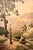 This watercolor of a mountain clearing featuring towering gum (eucalyptus) trees in the foreground, a dusty track, and a...