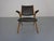 This beech boomerang chair from Louis van Teeffelen for Wébé originates from the 1960s and has black leather upholstery. I...