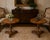A striking matched pair of octagonal pedestal side tables crafted in the Biedermeier / French Restauration revival style,...