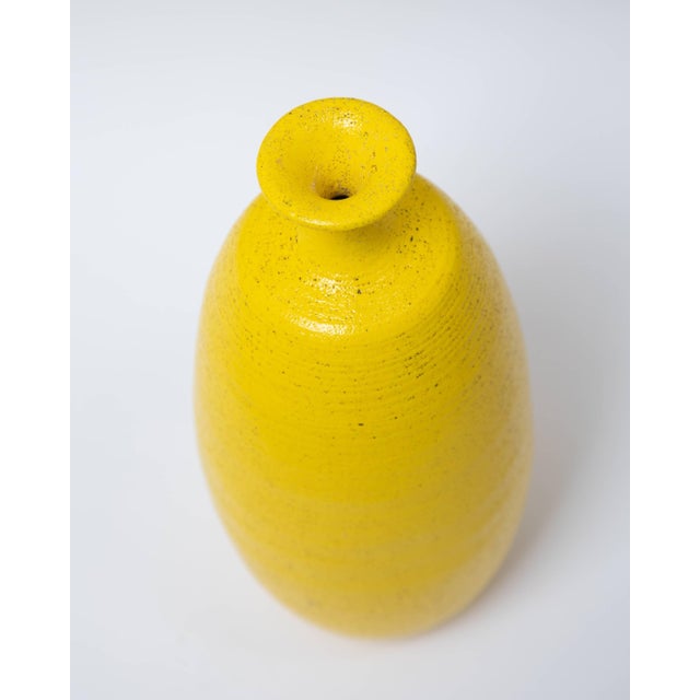 Handcrafted Pop Art yellow glaze ceramic bottle vase, circa 1960s. Stamped USA on bottom.