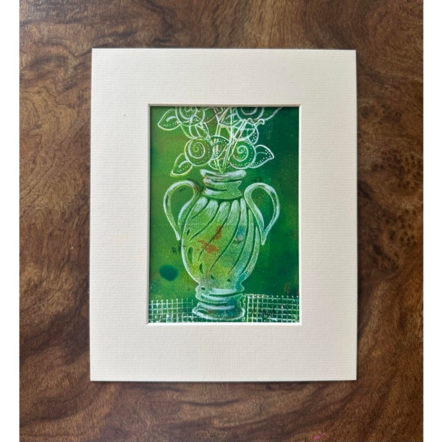 An original mixed media painting featuring a decorative emerald-green vessel overflowing with stylized blooms. Delicate...