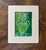 An original mixed media painting featuring a decorative emerald-green vessel overflowing with stylized blooms. Delicate...