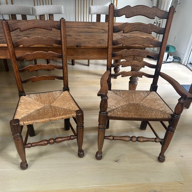 18th-19th Century Ladderback dining chairs. Oak or Elm wood. These chairs are very comfortable and stylish. There are 8...
