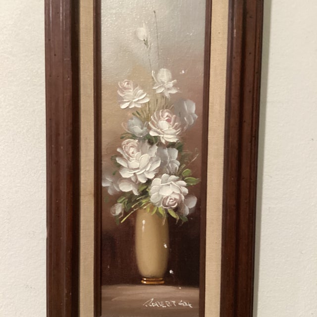 This vintage painting on driftwood titled “White Peony” by artist Robert Cox captures the essence of still life with its...
