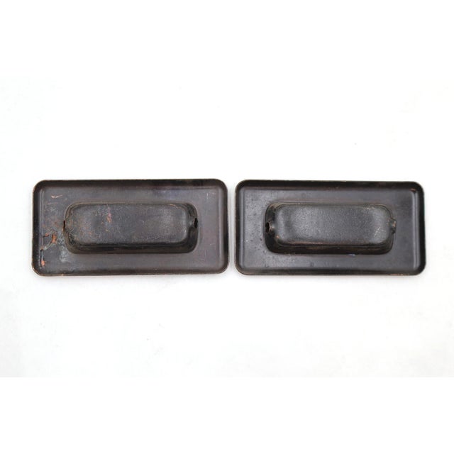 Vintage brass rectangular recessed window sash lifts with a japanned finish. The original mounting screws are not...