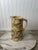 This heavy-weight, authentic American spongeware pitcher is a masterclass in late 19th-century utilitarian pottery....