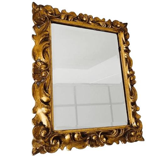 Vintage Italian Baroque gilded gold rectangular facet-cut mirror with a beautiful gilded carved frame from the 1960s. This...