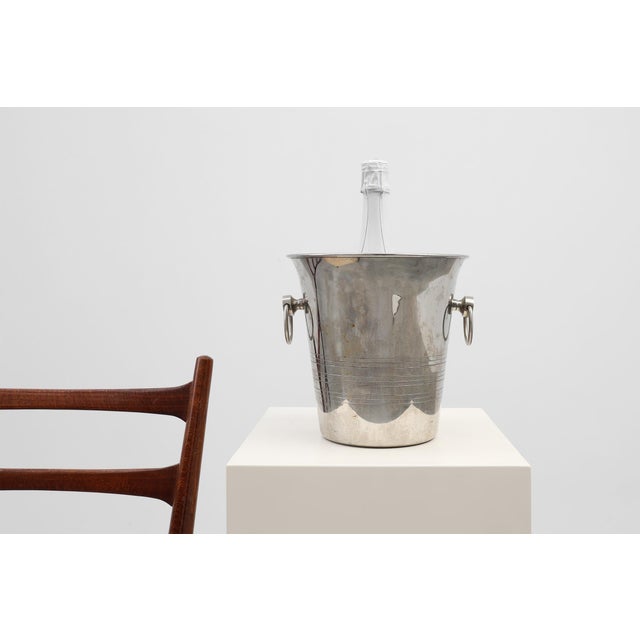 This elegant French Art Deco wine cooler from the 1930s exemplifies the period’s refined geometry and understated luxury....