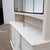 Antique pastry display case dating from the early 20th century. The upper glass section opens with wide sliding doors,...