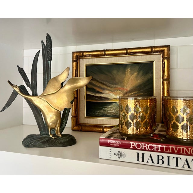 This beautiful duck and grasses figurine is heavy and sturdy. This could definitely be used as a bookend or doorstop or...