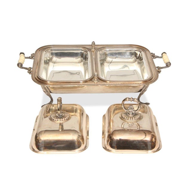 This Antique Silver Plated Chafing Dish is a timeless blend of elegance and practicality, perfect for both entertaining...