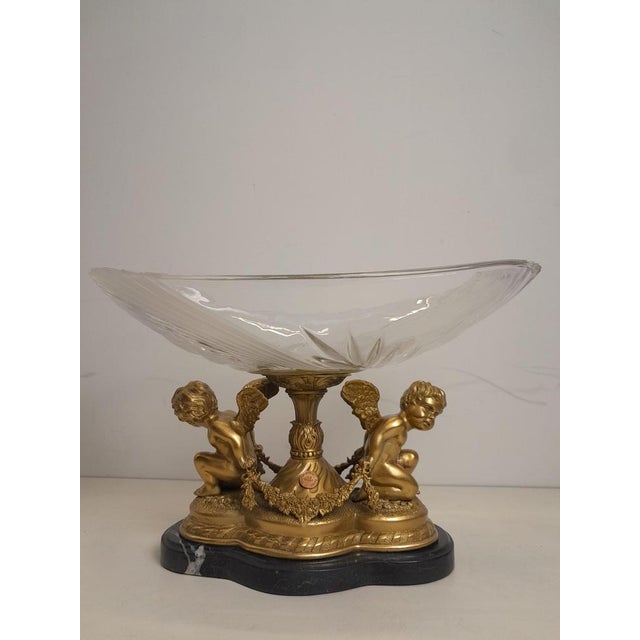 Cristal tray on a bronze foot decorated with angels. Marble pedestal on the bottom. Measurements: 24 L x 24 H