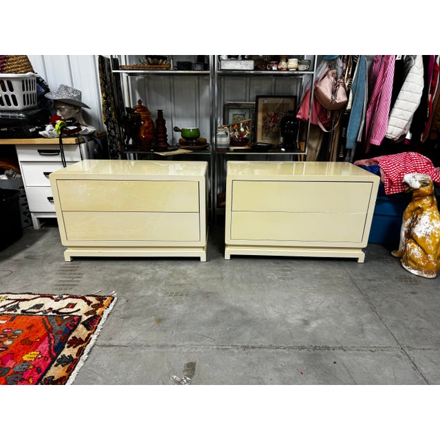 Stunning pair of tables. Very sturdy construction and heavy. In great used condition. High gloss cream with push release...