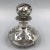 An exquisite and finely crafted antique Art Nouveau bottle with an ornate sterling silver overlay dating from around 1900....