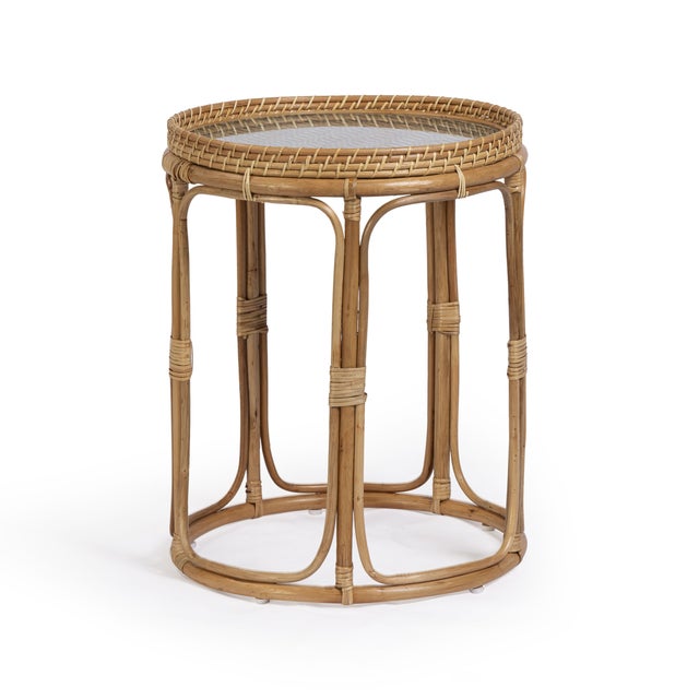 The Lindy Side Table is a warm, playful mix of texture and pattern. Its natural rattan frame is locally harvested and...