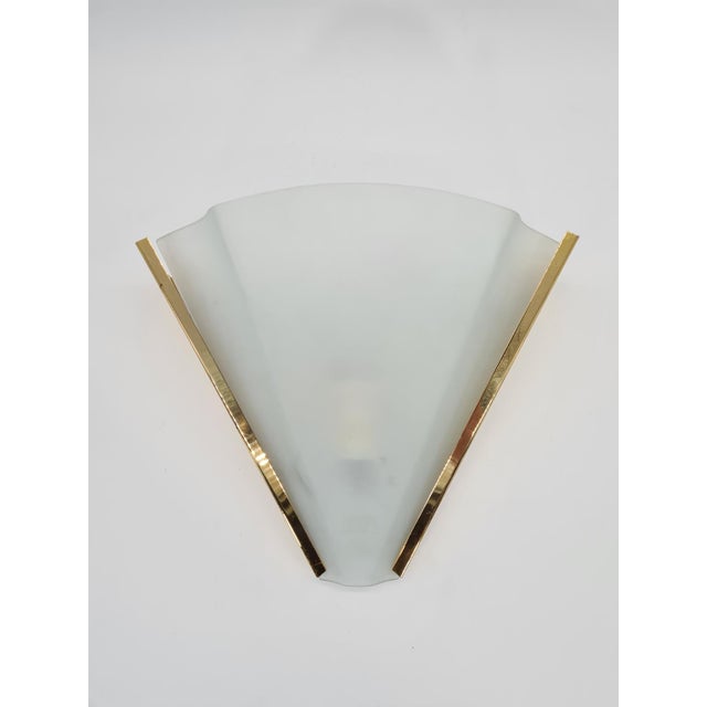 An original italian wall lamp manufactured by errebi luce in the 1980s. this model has an elegant, geometric shape with...