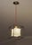 LIGHTMASS P1 is a handmade pendant light with a natural sheepskin shade suspended inside a cube frame of heat-blackened...