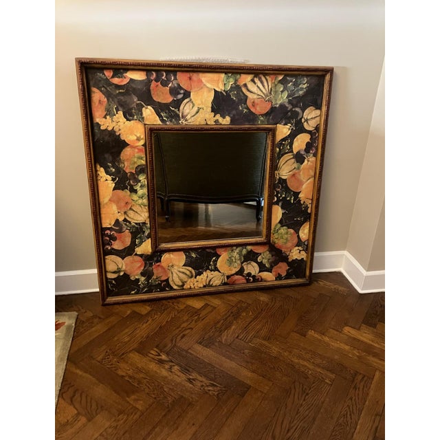 This vintage mirror with highly decorative frame serves as a piece of artwork. The painted or appliquéd border look like...