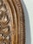 A set of three carved wooden panels, crafted from a single block of wood, depicting animal scenes. Each panel is carved...