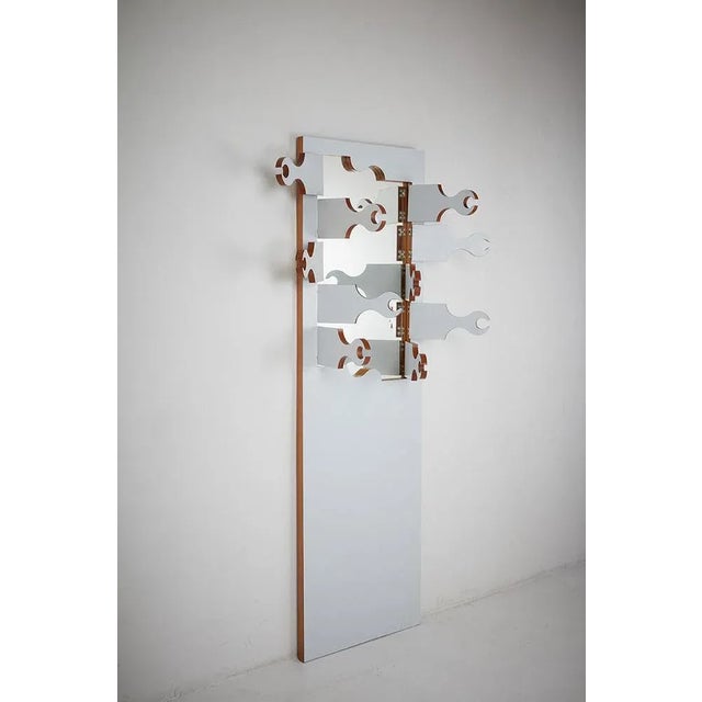 Wooden structure partially covered in ant with mirror and articulated fans with hinges. Production bonetto period 1970...