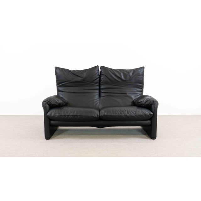 Maralunga 2-seater sofa by Cassina, designed in 1973 by Vico Magistretti. This sofa features foldable backrests to allow...